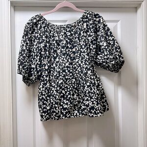 black blouse with small white flowers